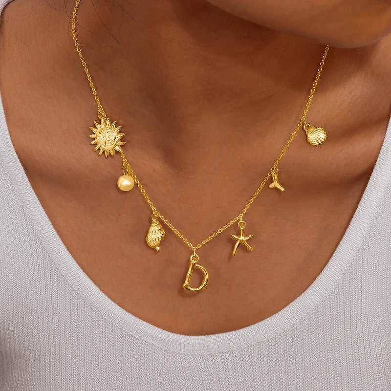 Eugénie | Collier initiale coquillage