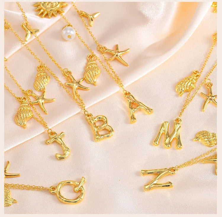 Eugénie | Collier initiale coquillage